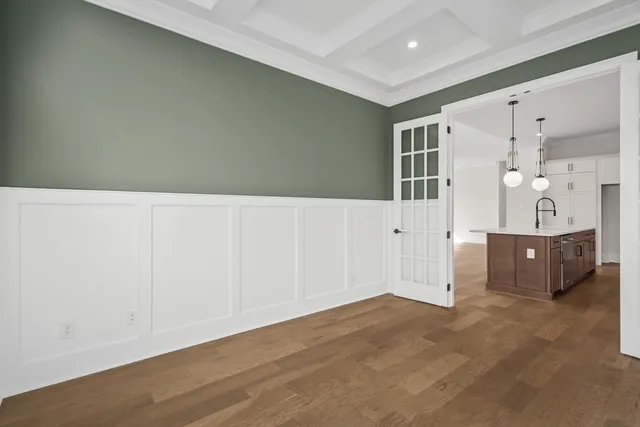 a bathroom with a double vanity sink a mirror and a bathtub