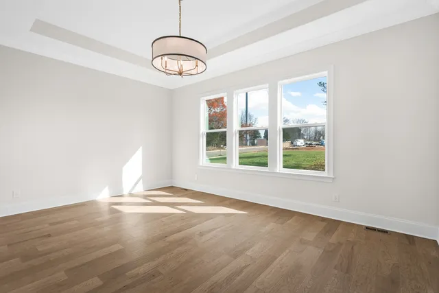 a white bath tub sitting next to a shower