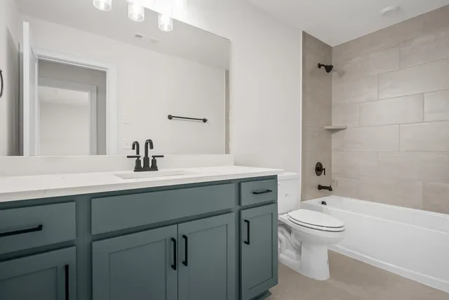 a living room with a fireplace and a floor to ceiling window