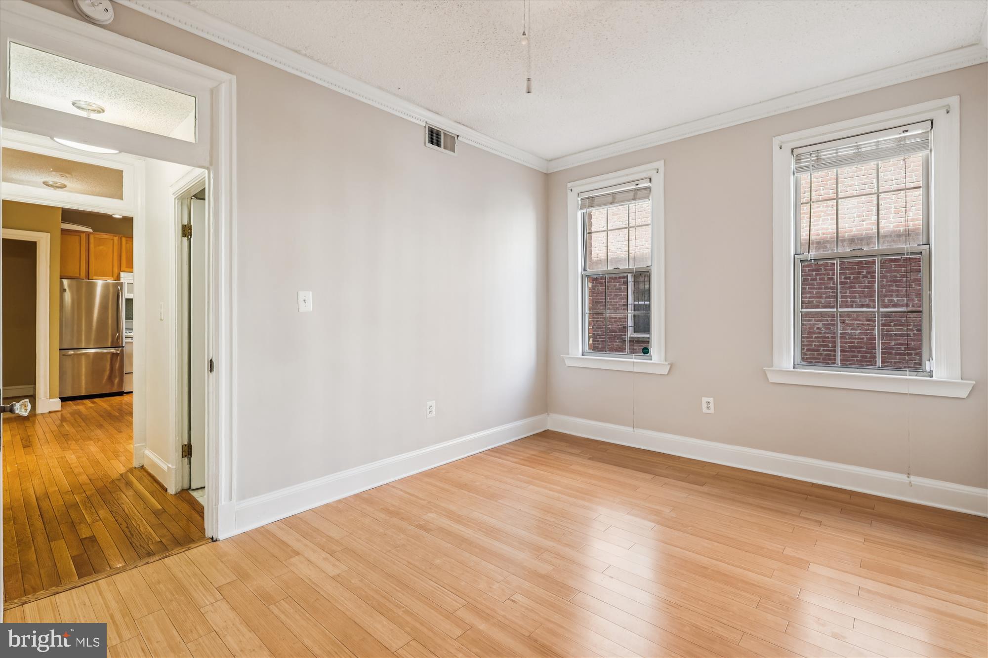 1401 Columbia Road Northwest, Unit 209 Washington, DC 20009 - Photo 13 of 34 a view of empty room with wooden floor and fan
