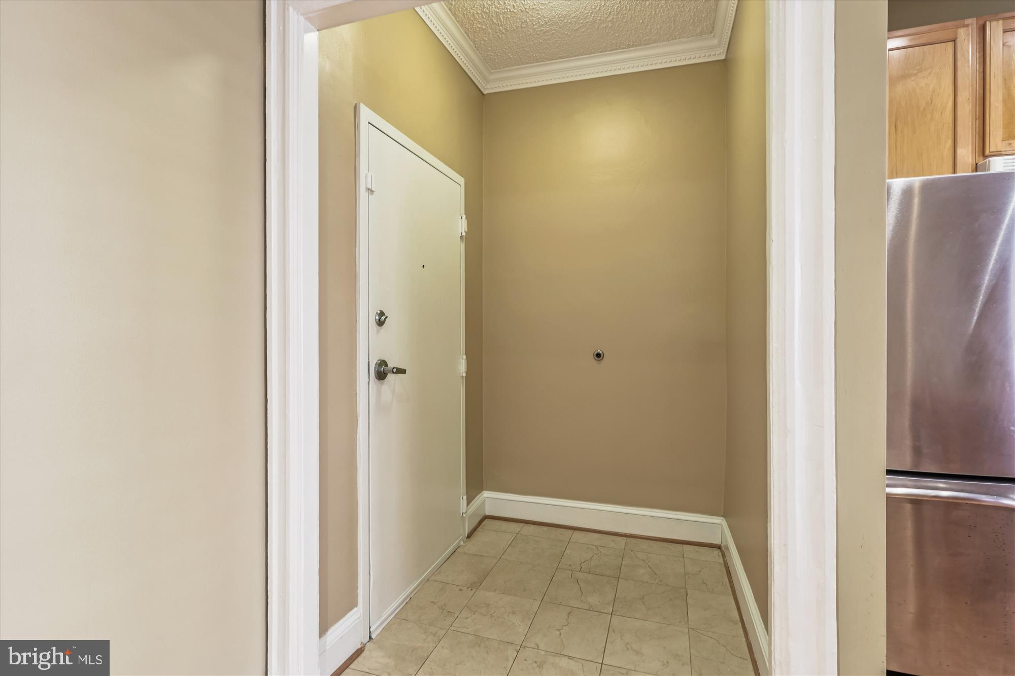 1401 Columbia Road Northwest, Unit 209 Washington, DC 20009 - Photo 2 of 34 a view of a hallway with a refrigerator