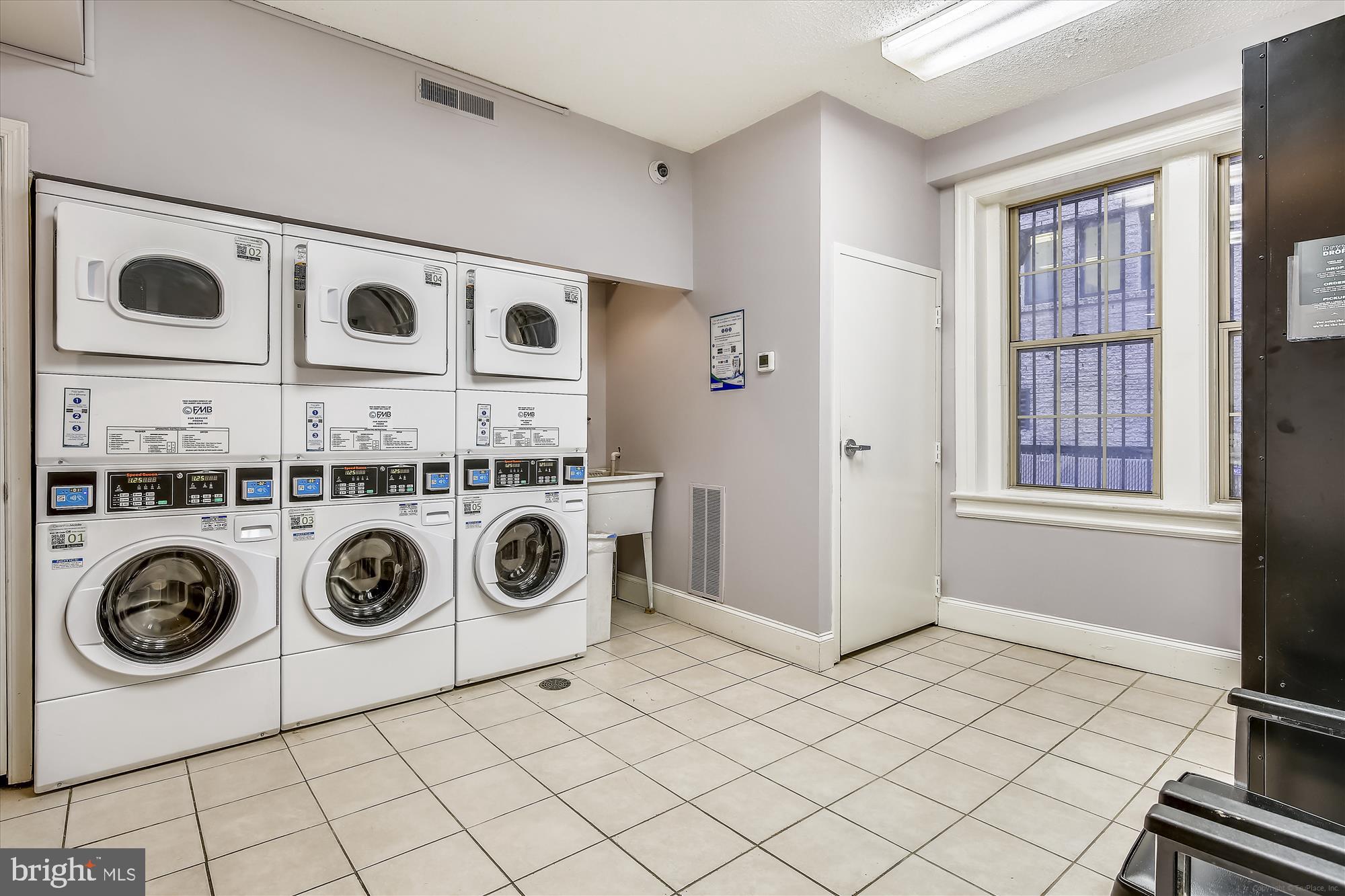 1401 Columbia Road Northwest, Unit 209 Washington, DC 20009 - Photo 32 of 34 a utility room with dryer and washer