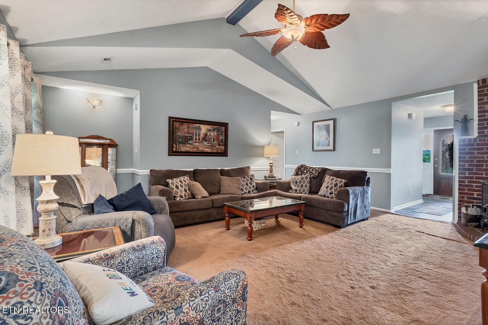 449 Foss Road Maryville, TN 37801 - Photo 17 of 49 a living room with furniture a rug and a chandelier