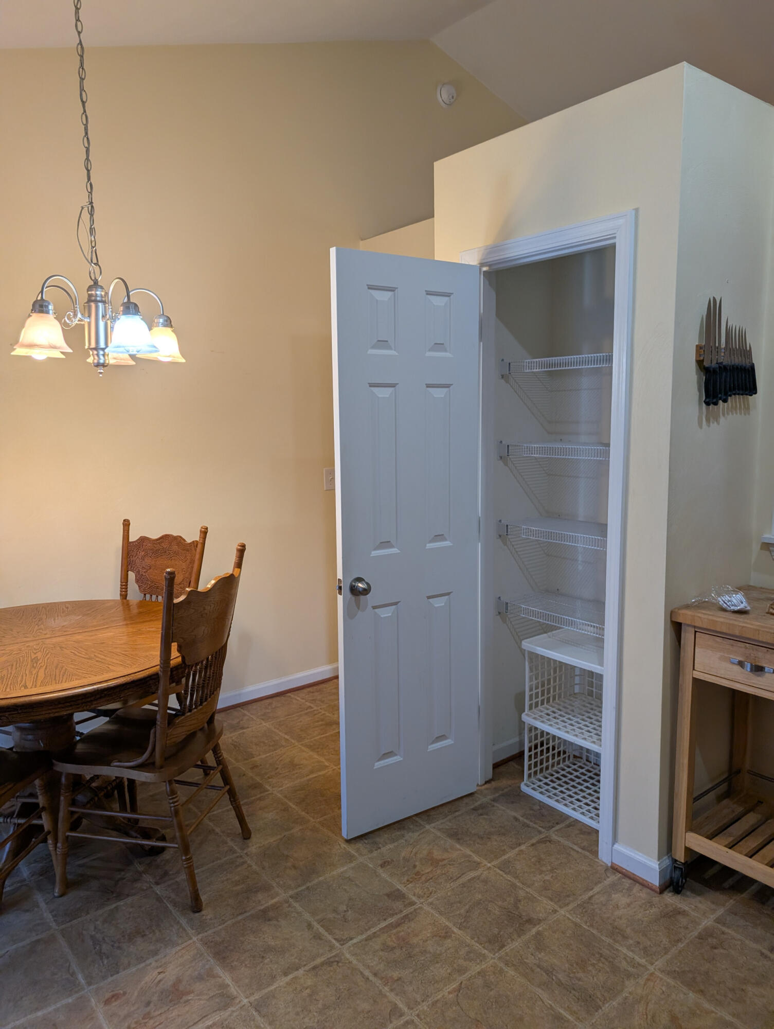 1126 Gearhart Road Southeast Roanoke, VA 24014 - Photo 5 of 13 a view of a dining room with furniture and a chandelier fan