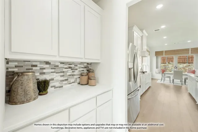 a kitchen with stainless steel appliances kitchen island granite countertop a sink and cabinets