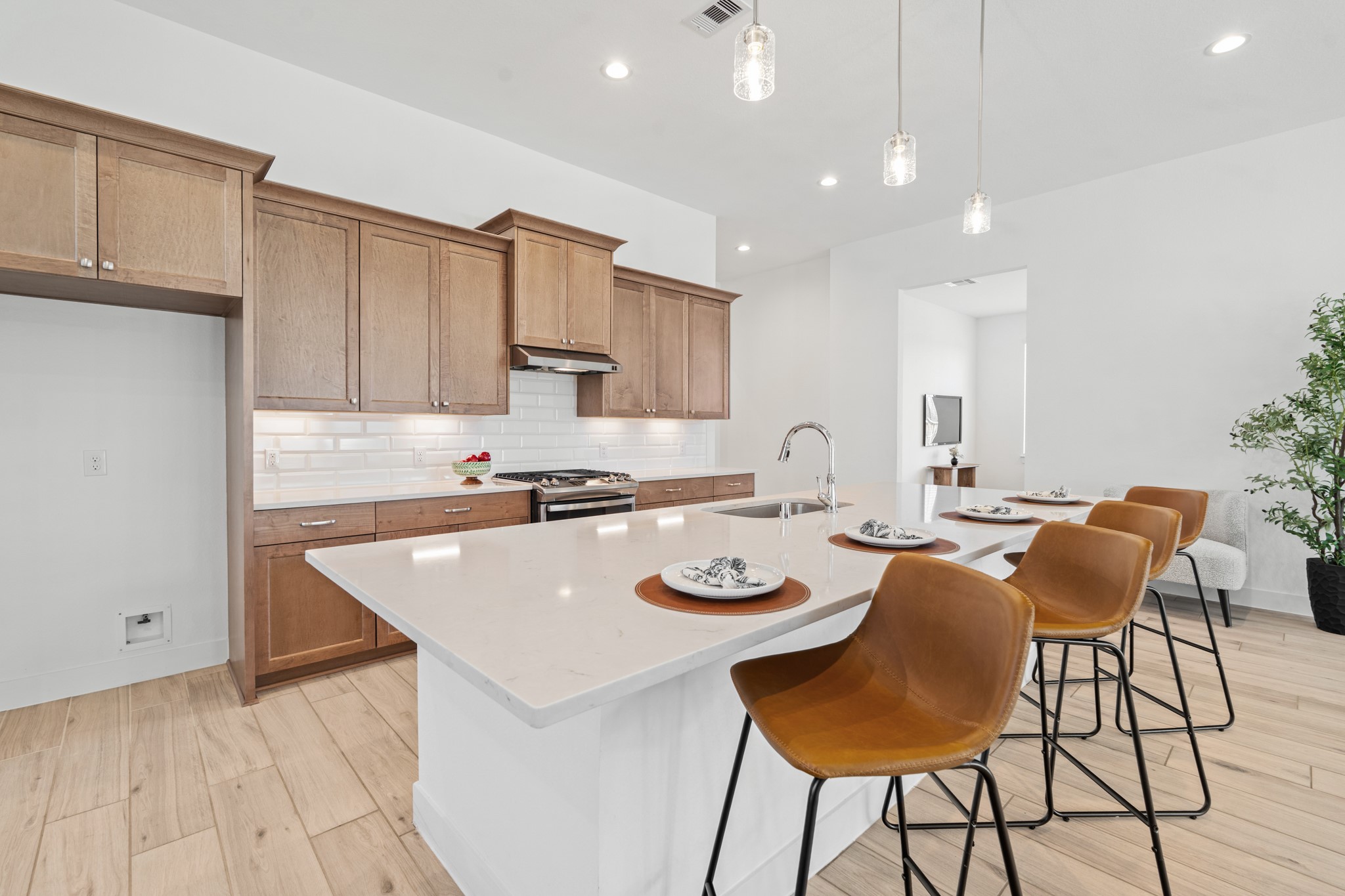 7403 Hanover Lane Katy, TX 77493 - Photo 11 of 46 Your family and guests will enjoy many nights of fun, food and entertainment with ample counter space and kitchen island for setting up a wonderful array of provisions!