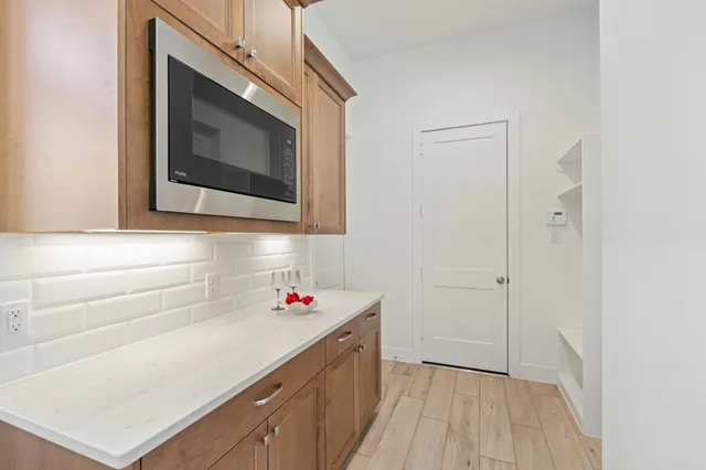 a hallway with washer and dryer
