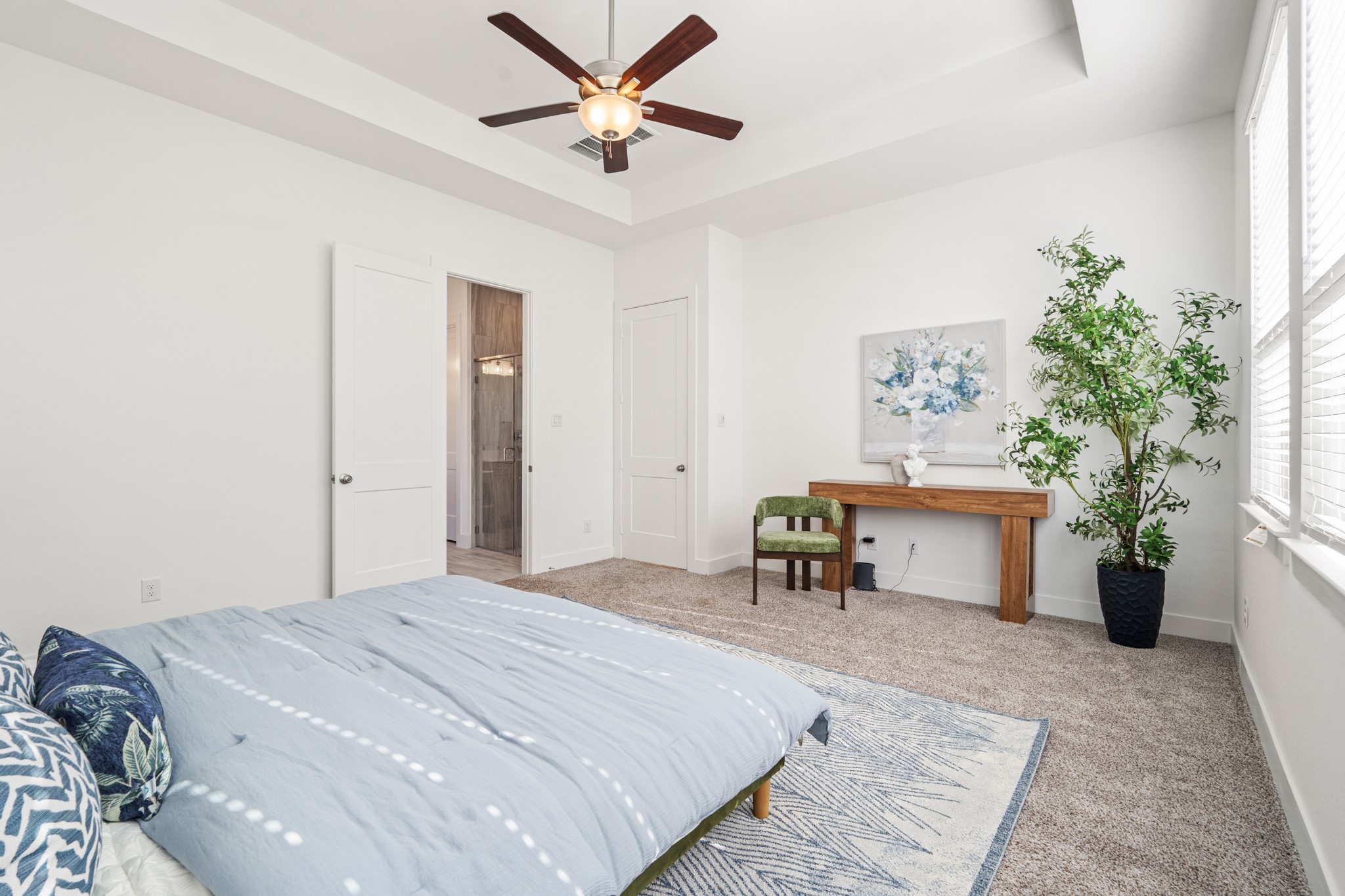 7403 Hanover Lane Katy, TX 77493 - Photo 19 of 46 Come relax in the primary retreat with plush carpet, ceiling fan, and direct access to your ensuite primary bathroom!