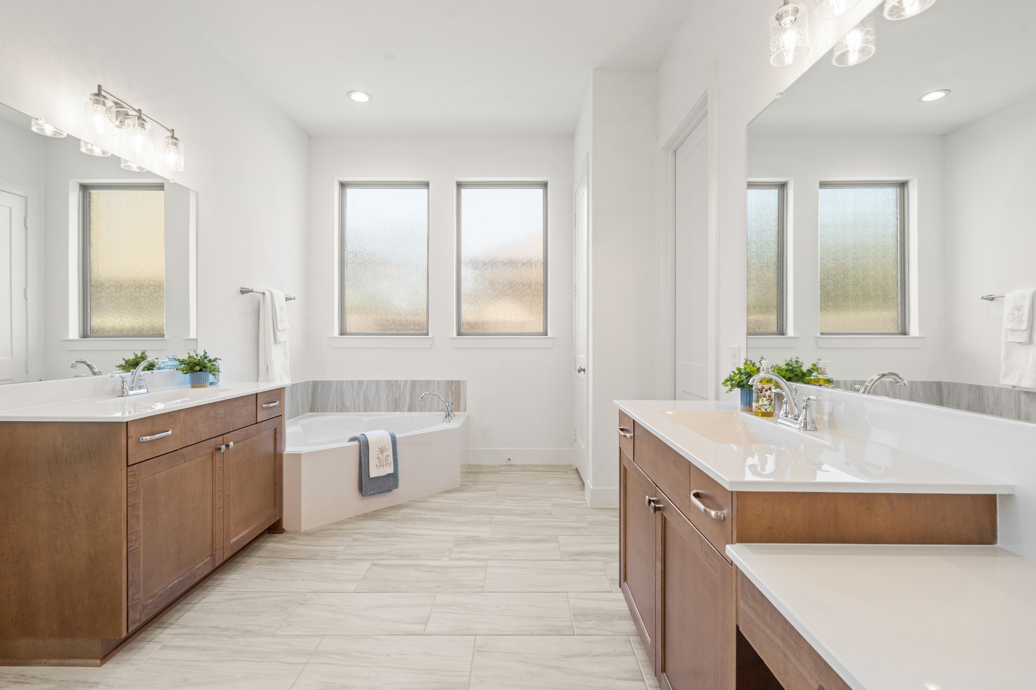 7403 Hanover Lane Katy, TX 77493 - Photo 21 of 46 A spa sized garden tub with tile surround sits separately and is tucked into a nook, allowing for a tranquil retreat!