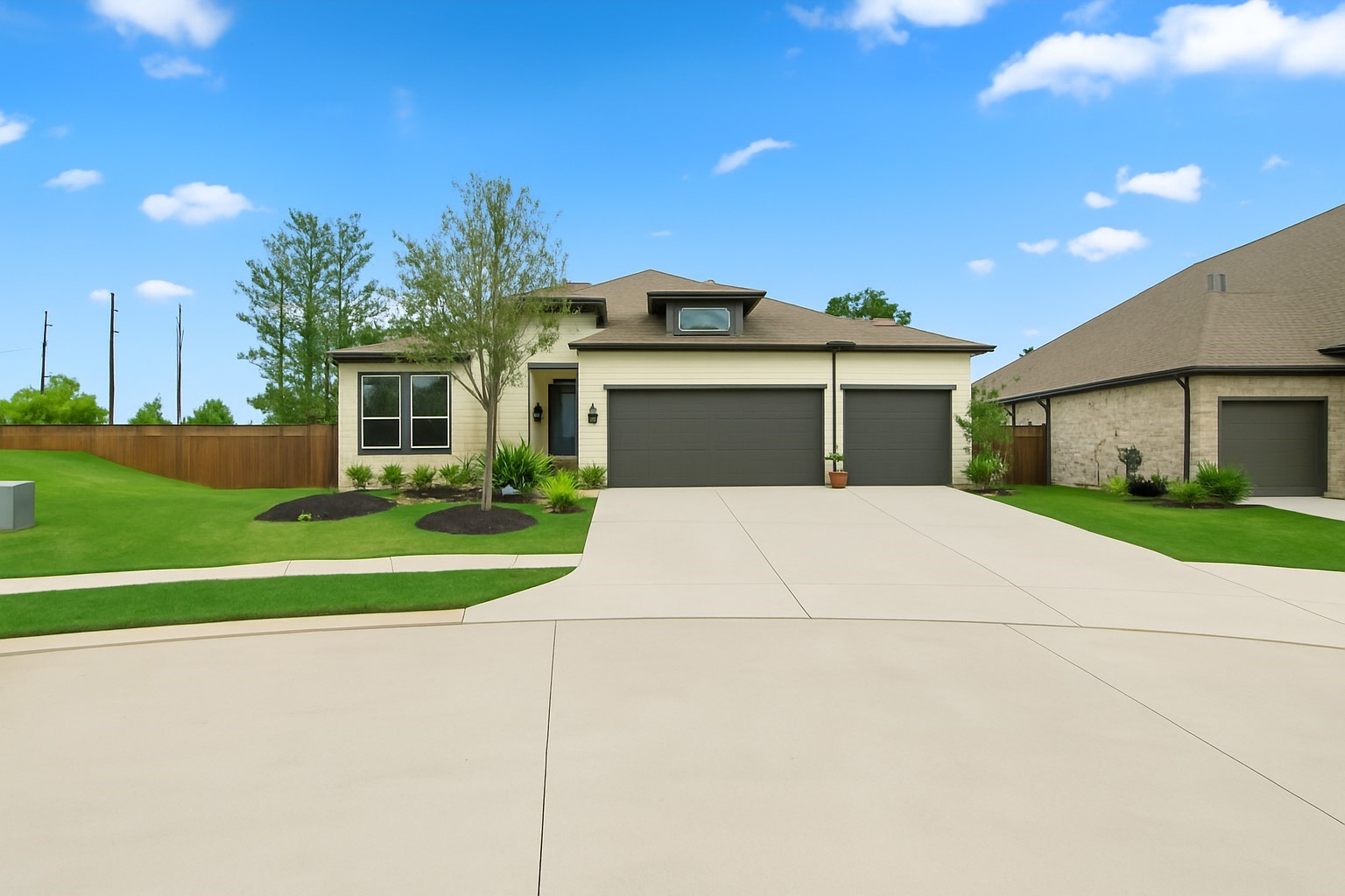 7403 Hanover Lane Katy, TX 77493 - Photo 40 of 46 7403 Hanover Ln offers an oversized garage with a 3rd car bay! The exterior can be converted to give additional entry! *This photo has been virtually edited to show the third car garage door and additional driveway space