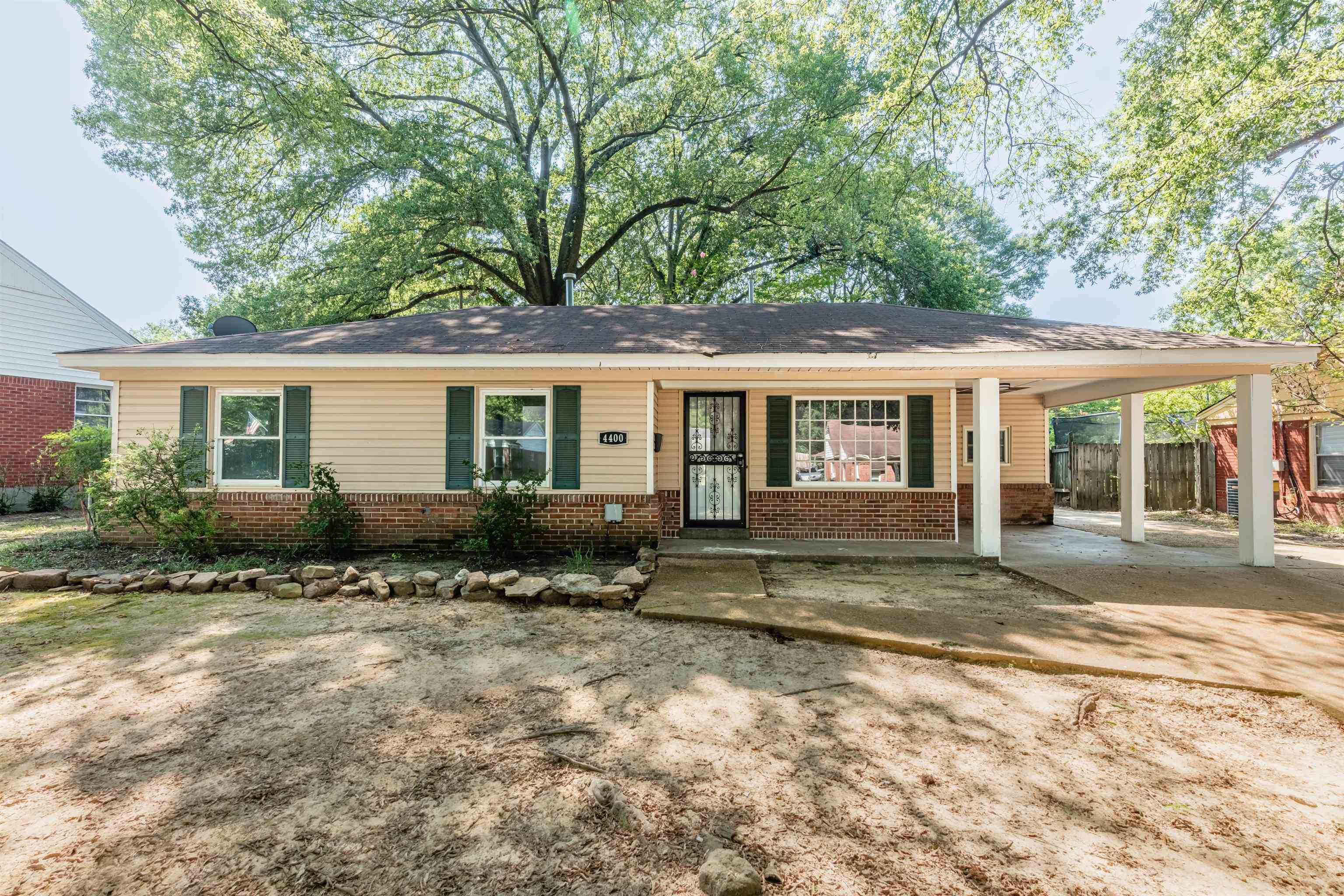 4400 Helene Road Memphis, TN 38117 - Photo 1 of 31 a view of a house with a patio and a yard
