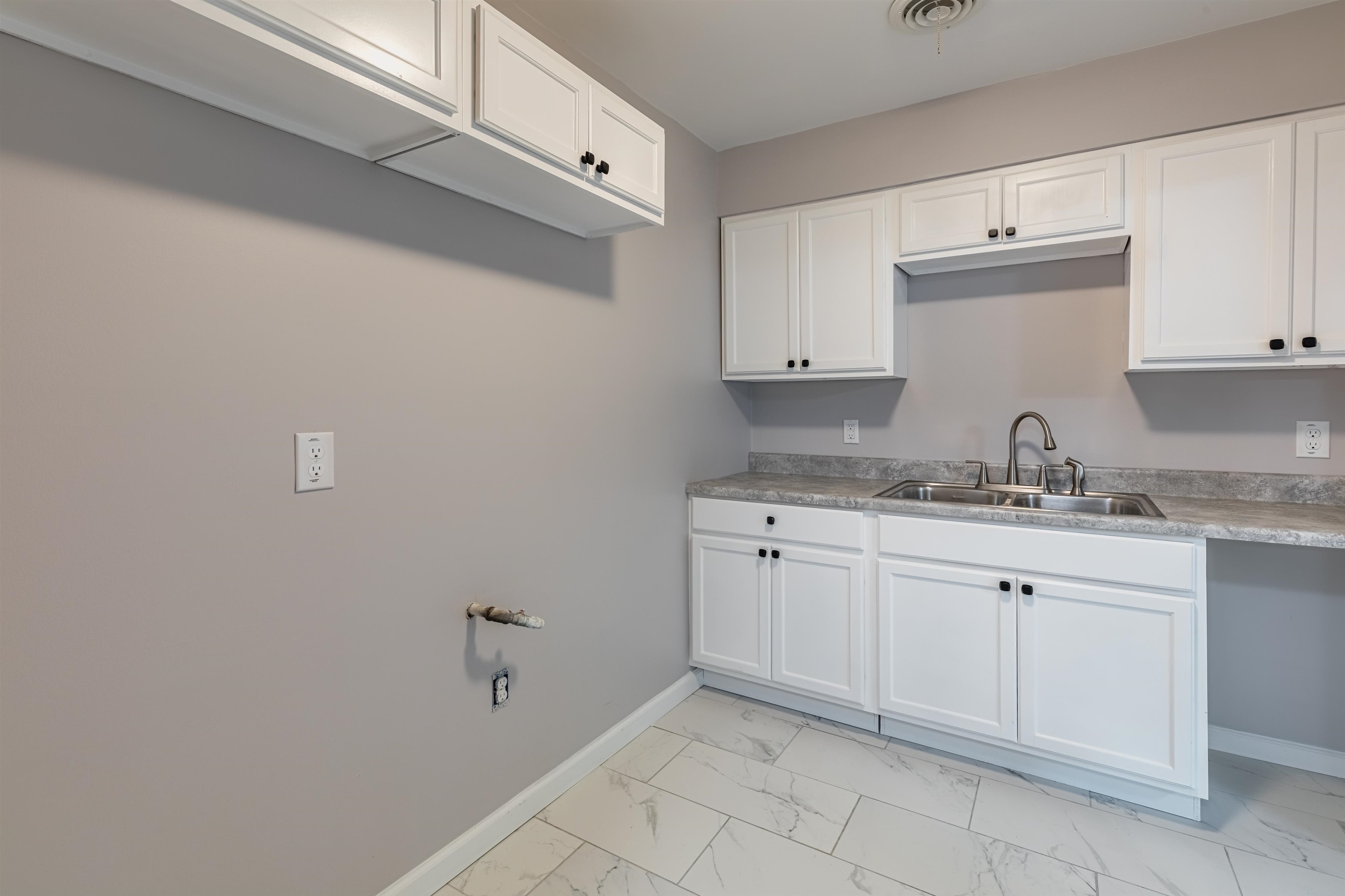 4400 Helene Road Memphis, TN 38117 - Photo 13 of 31 a kitchen with granite countertop white cabinets and a sink