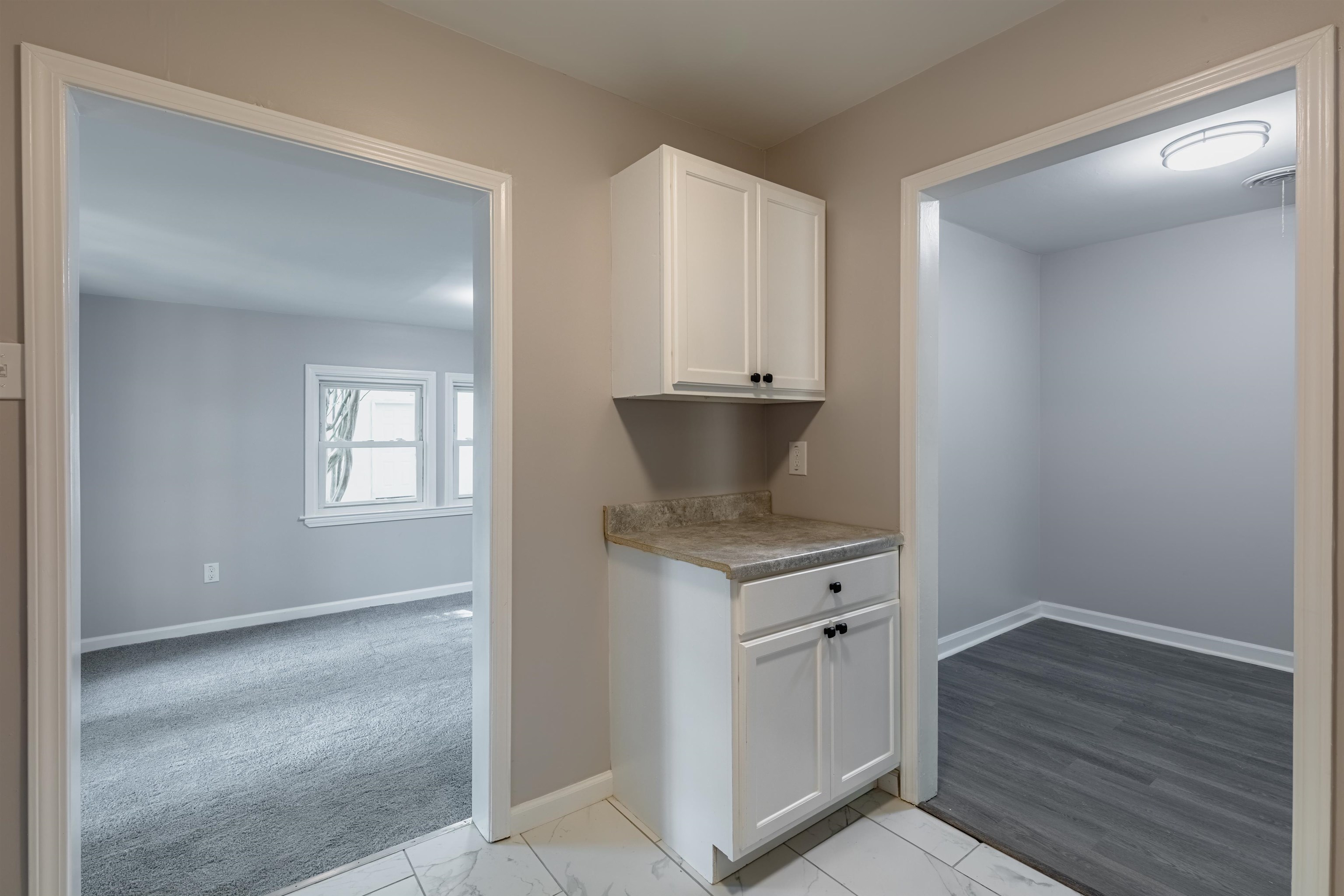 4400 Helene Road Memphis, TN 38117 - Photo 16 of 31 an empty room with wooden floor and cabinet