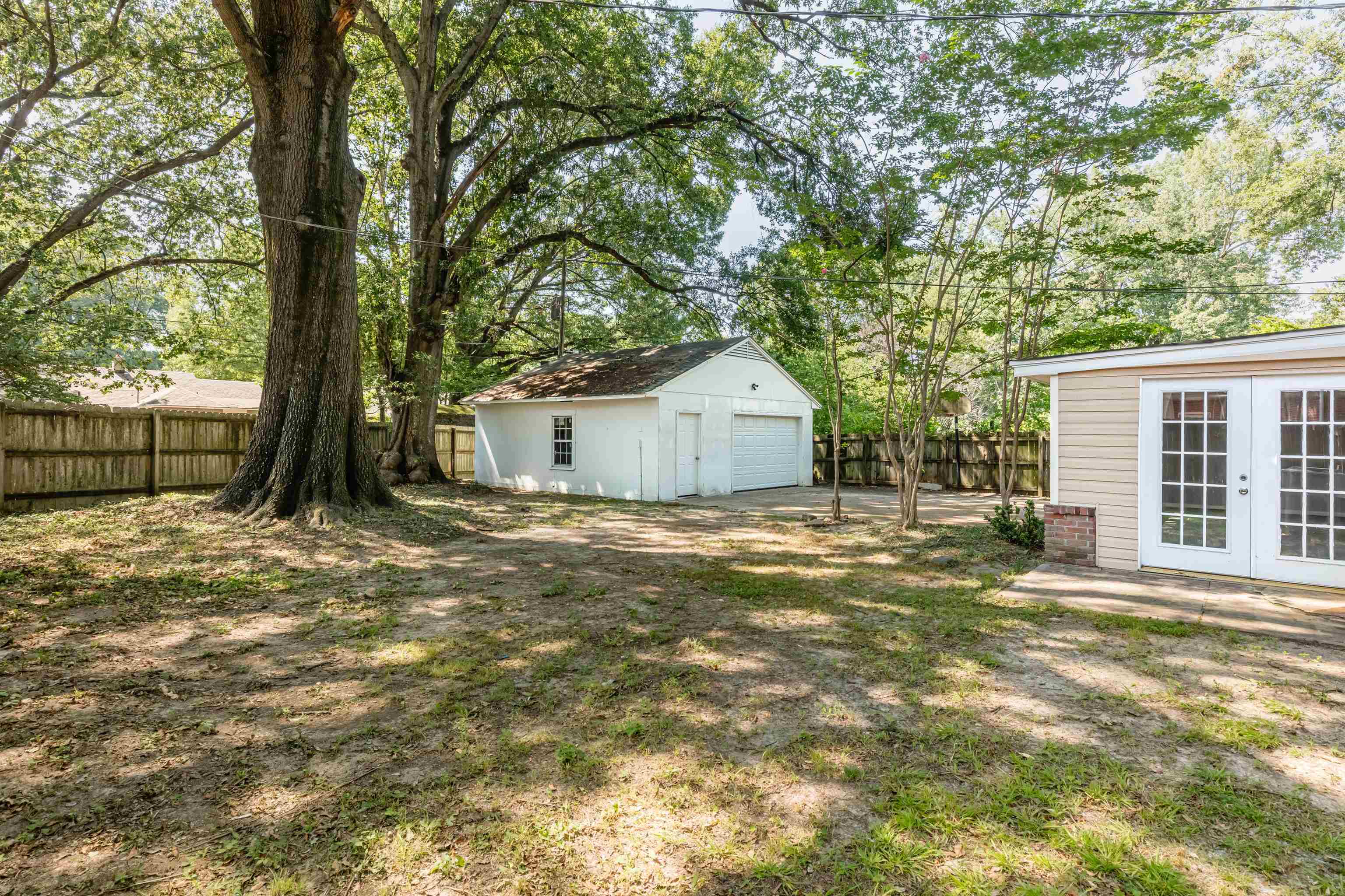 4400 Helene Road Memphis, TN 38117 - Photo 27 of 31 a front view of a house with a garden and tree