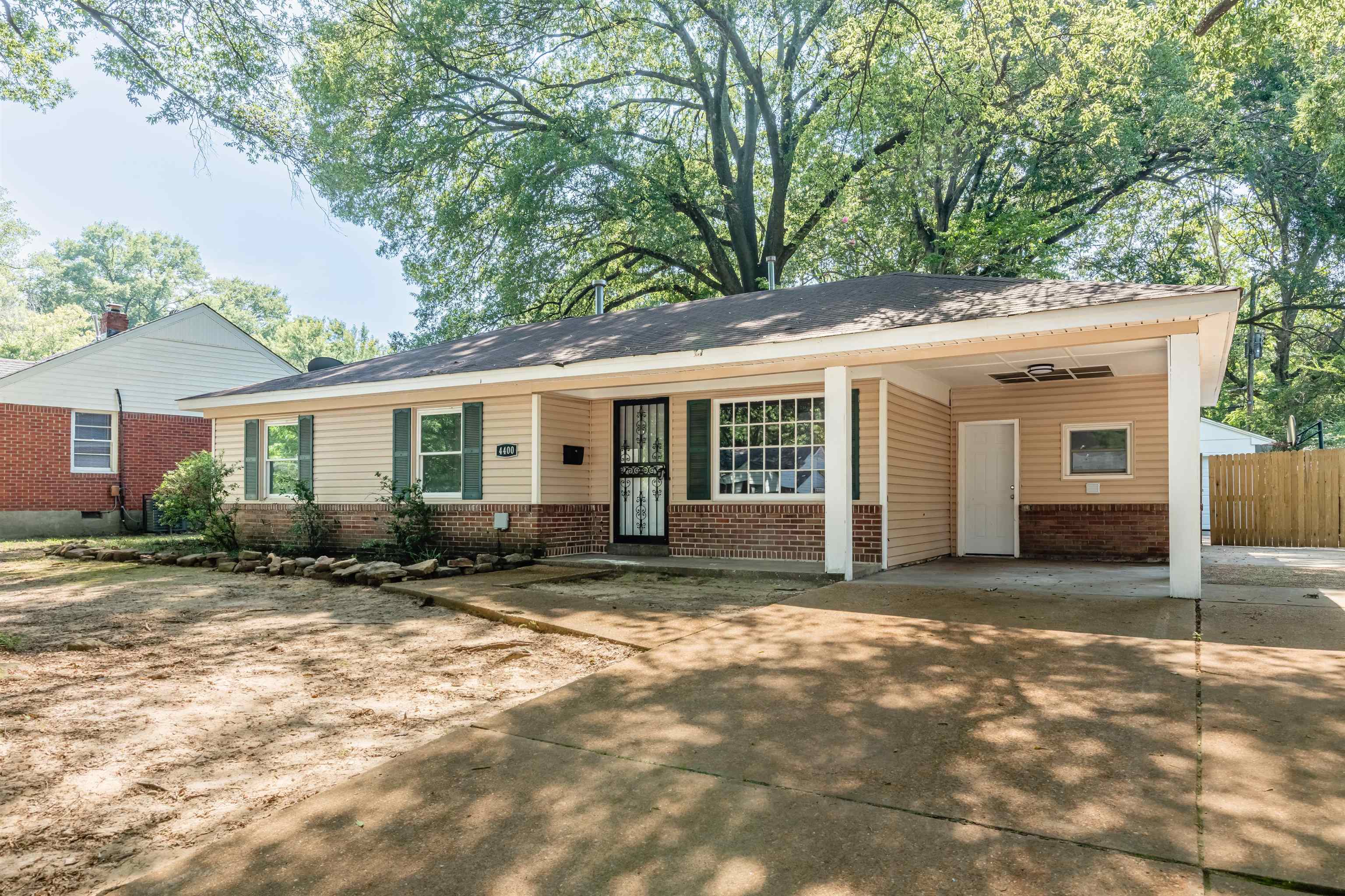 4400 Helene Road Memphis, TN 38117 - Photo 4 of 31 a view of a house with backyard sitting area and porch