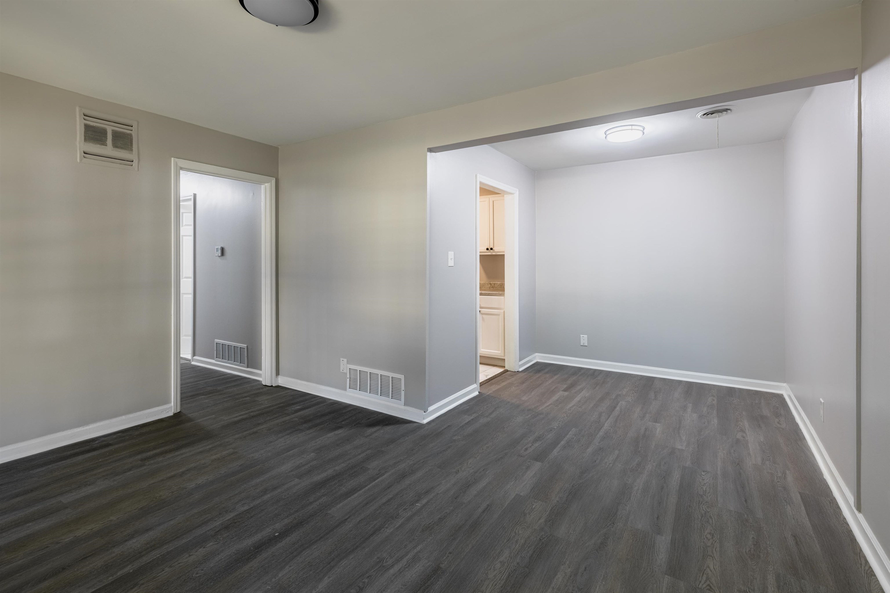 4400 Helene Road Memphis, TN 38117 - Photo 7 of 31 a view of an empty room with wooden floor and closet