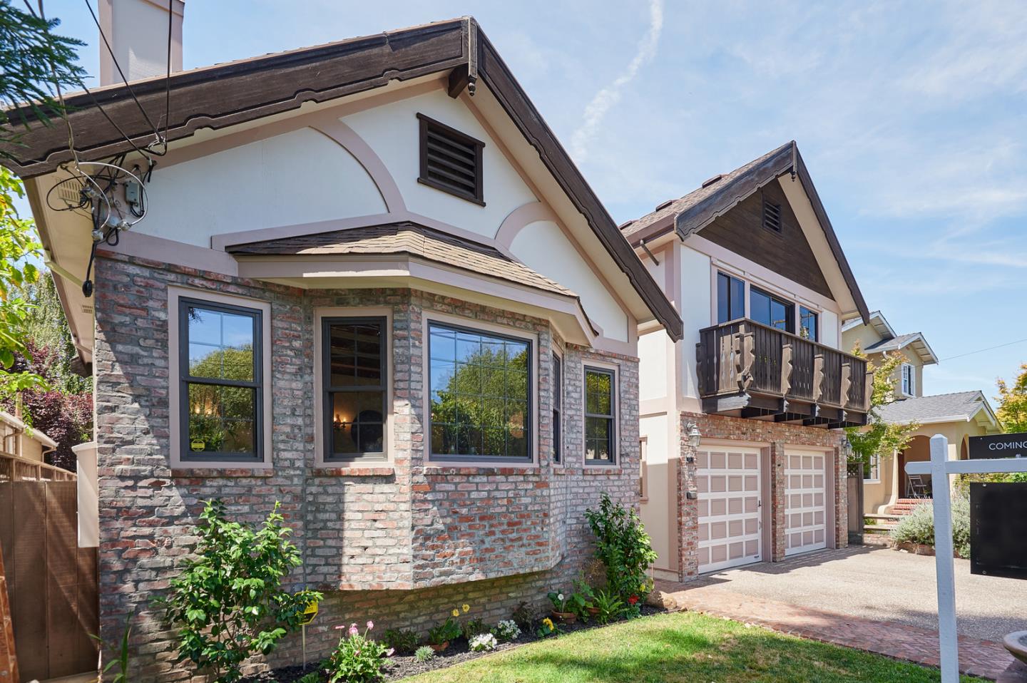 a front view of a house with garden