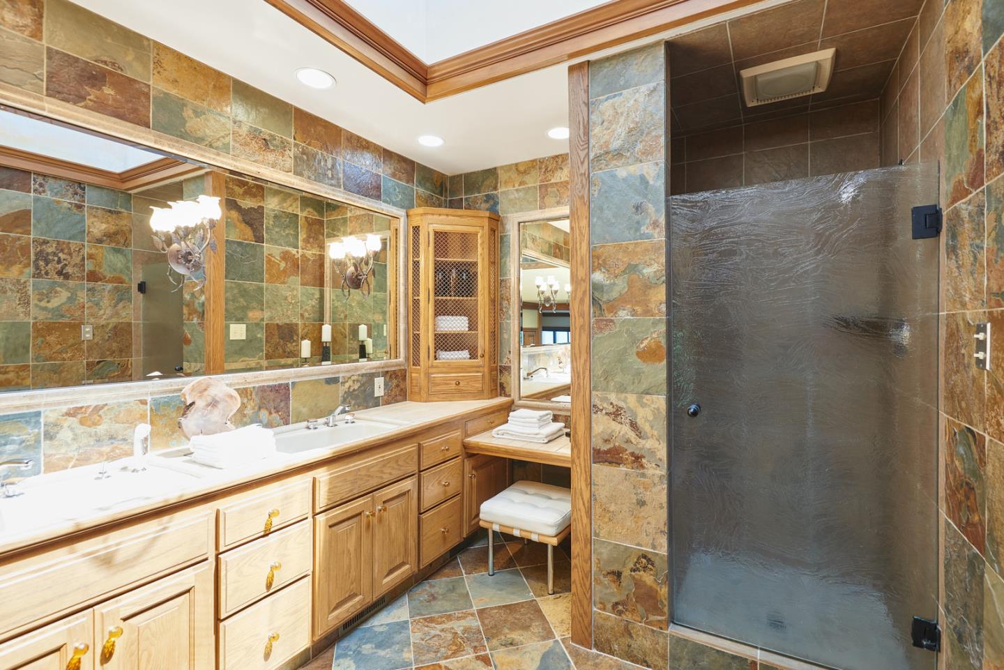 17 Bancroft Road Burlingame, CA 94010 - Photo 15 of 25 a bathroom with a double vanity sink toilet and shower