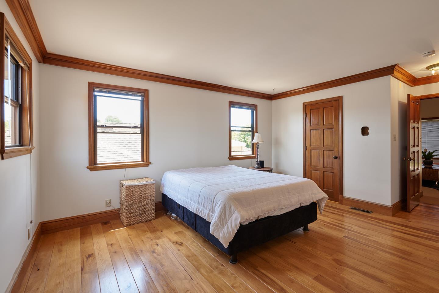 17 Bancroft Road Burlingame, CA 94010 - Photo 18 of 25 a bedroom with a bed and wooden floor