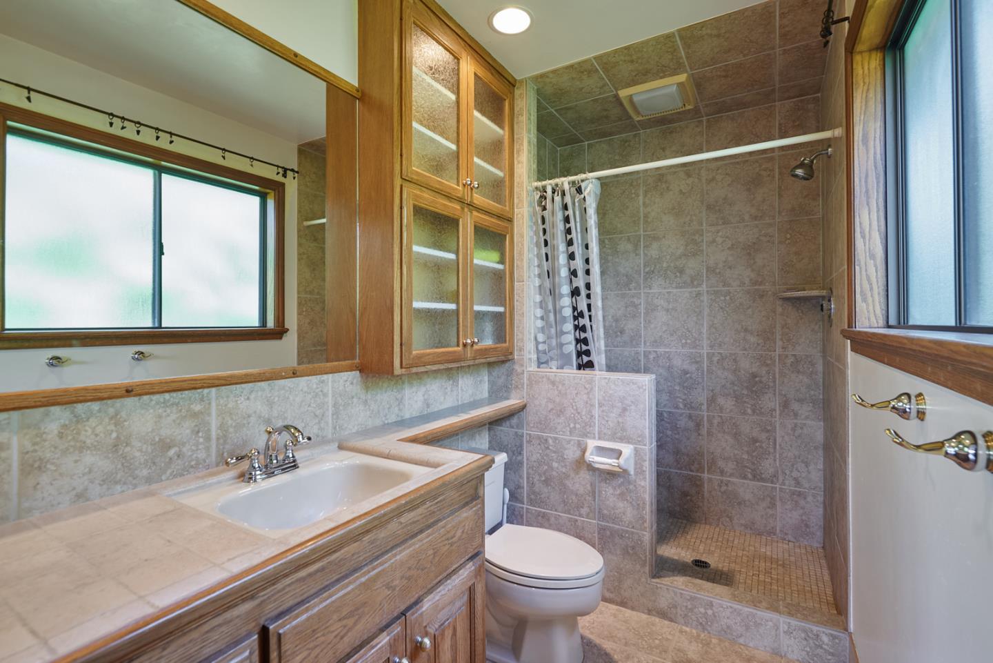 17 Bancroft Road Burlingame, CA 94010 - Photo 21 of 25 a bathroom with a sink a toilet and shower