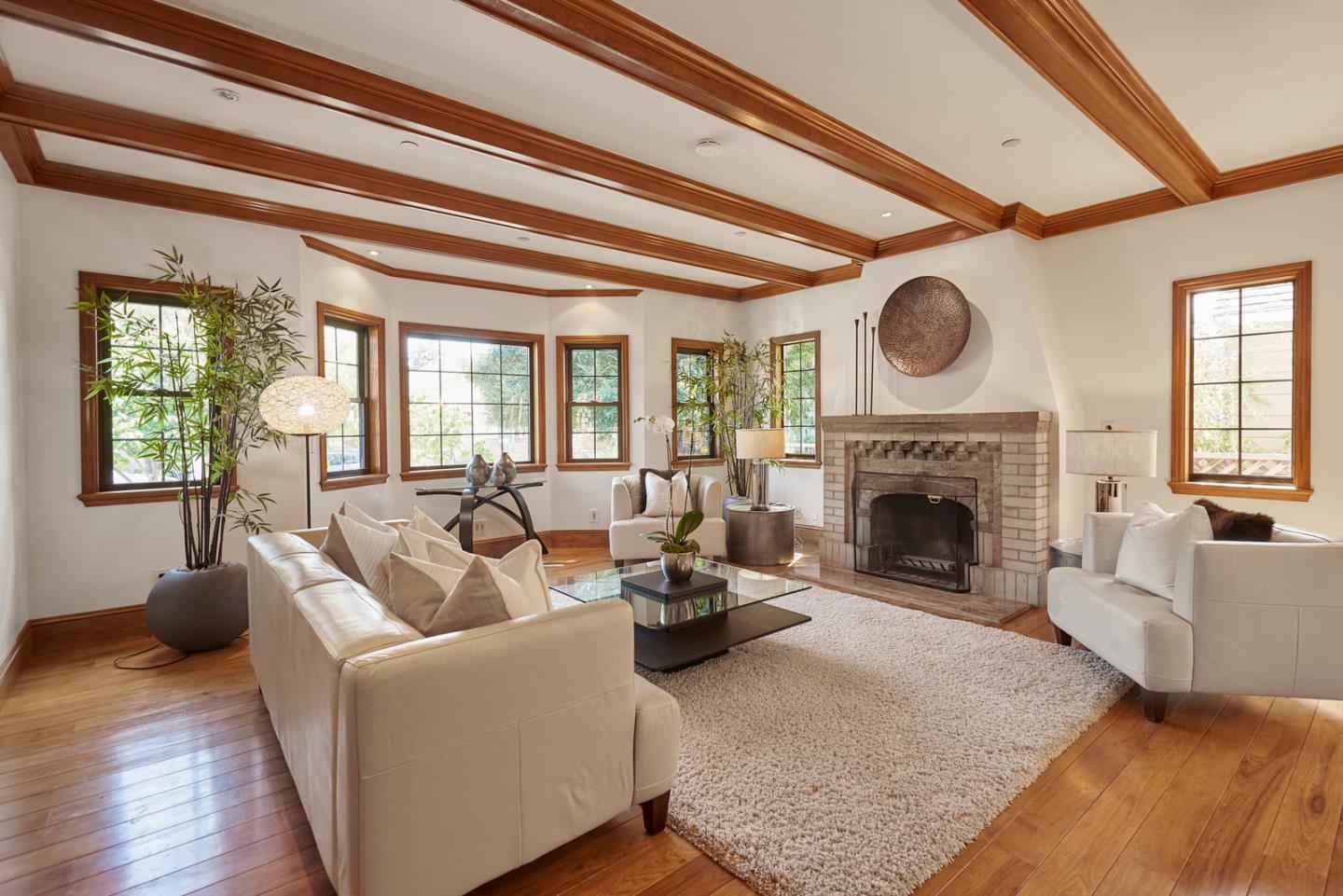 17 Bancroft Road Burlingame, CA 94010 - Photo 4 of 25 a living room with furniture a fireplace and a large window