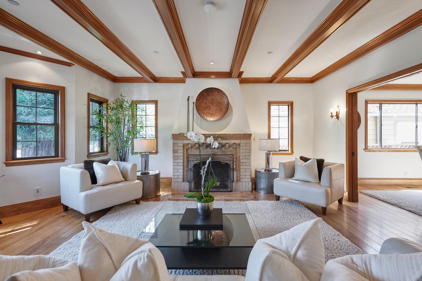 17 Bancroft Road Burlingame, CA 94010 - Photo 5 of 25 a living room with furniture a fireplace and a large window