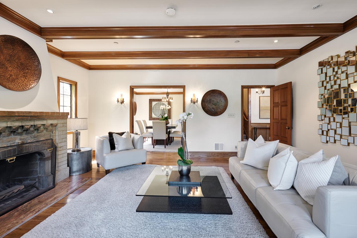 17 Bancroft Road Burlingame, CA 94010 - Photo 6 of 25 a living room with furniture a rug and a fireplace