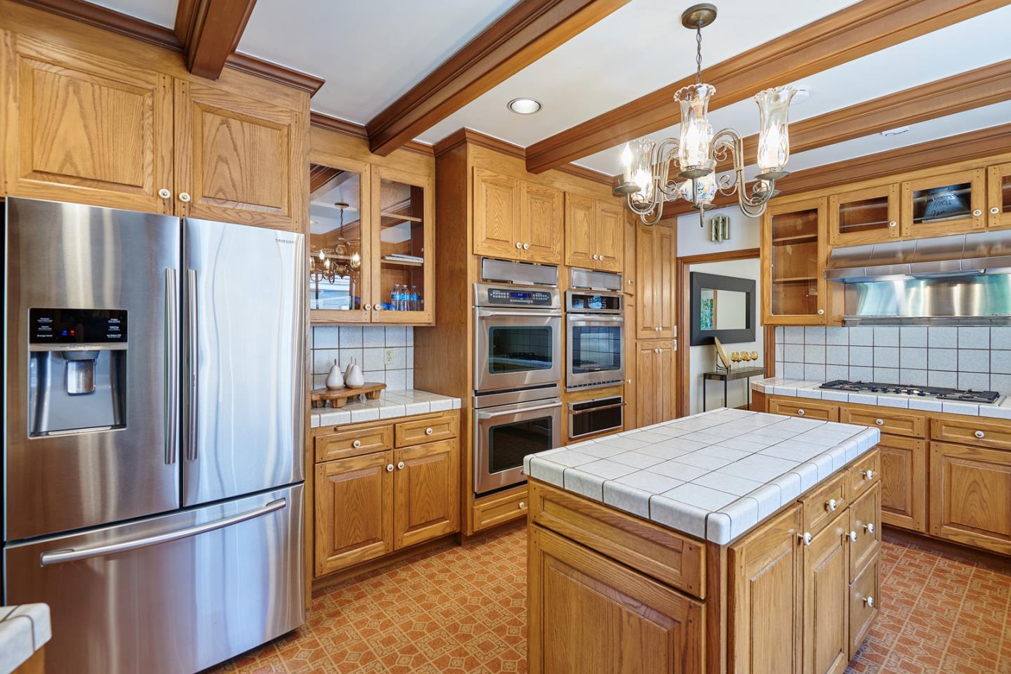 17 Bancroft Road Burlingame, CA 94010 - Photo 10 of 25 a kitchen with a refrigerator and a sink