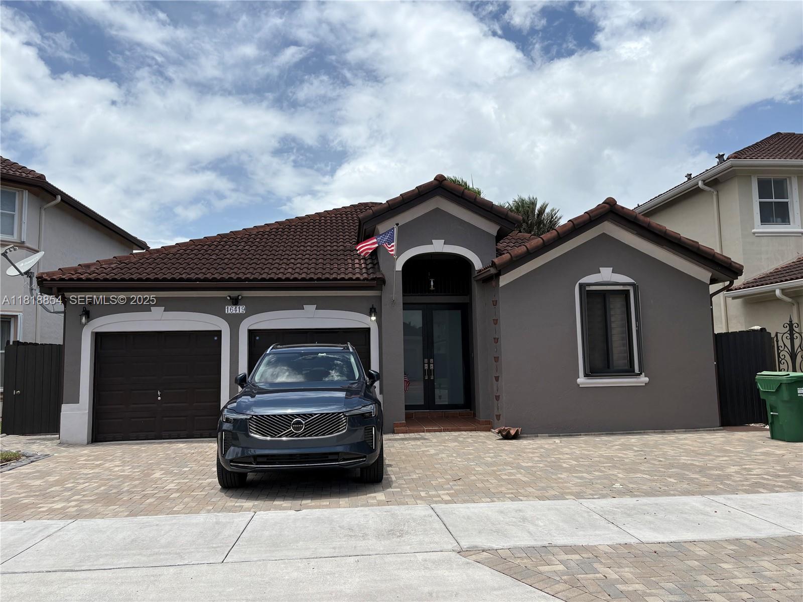 a car parked in front of a house