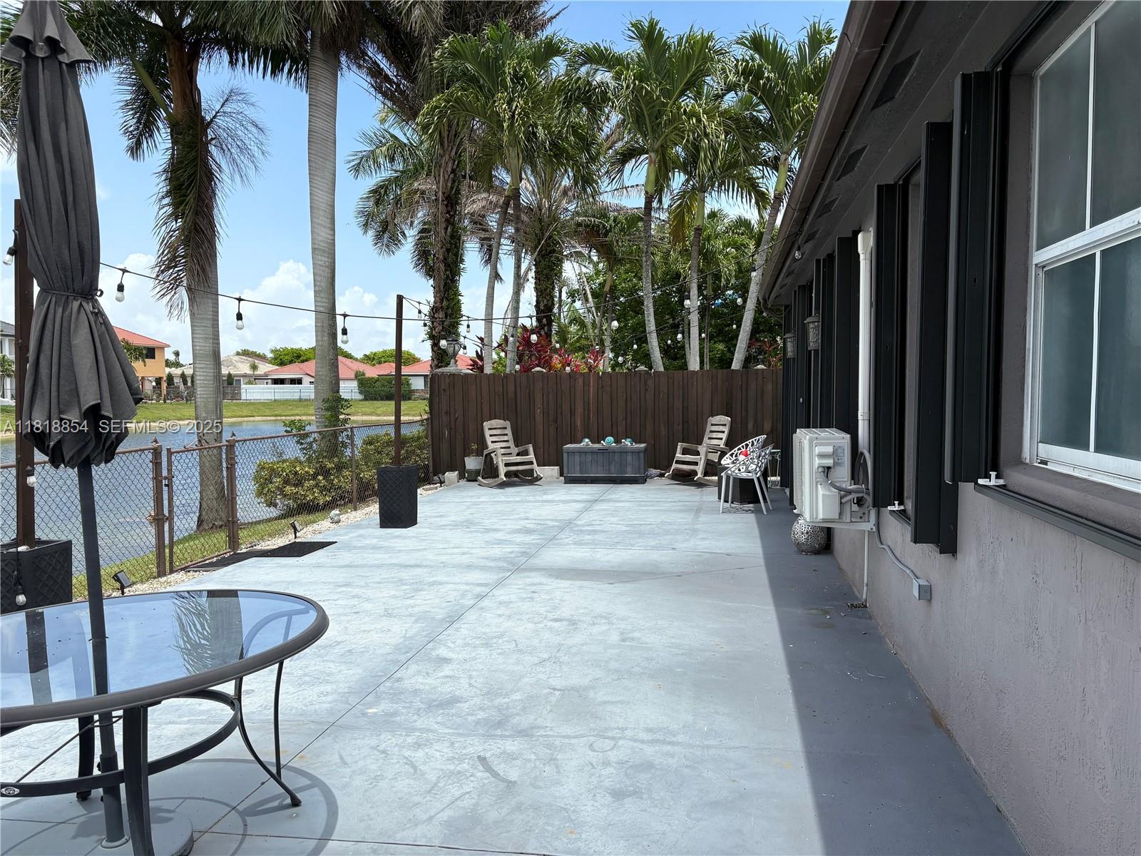 16419 Southwest 84th Street Miami, FL 33193 - Photo 14 of 15 a view of a backyard with palm trees