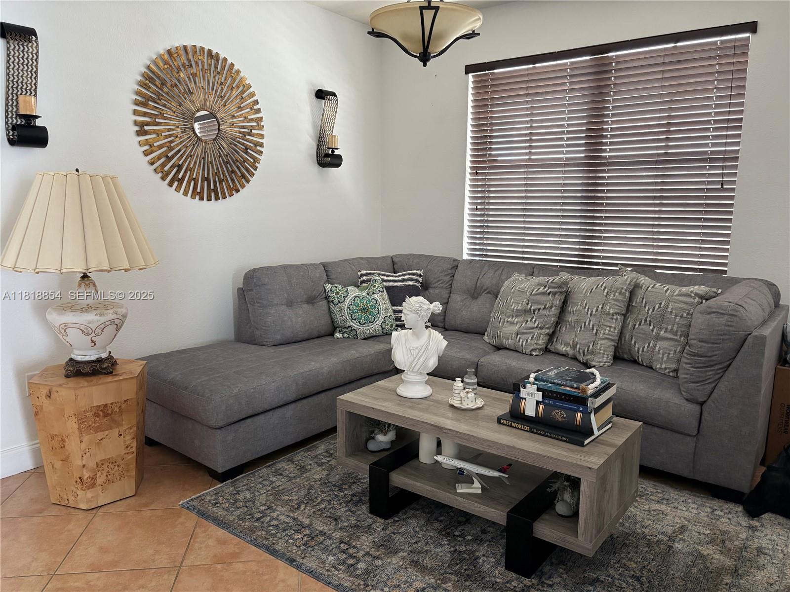 16419 Southwest 84th Street Miami, FL 33193 - Photo 4 of 15 a living room with furniture and a window