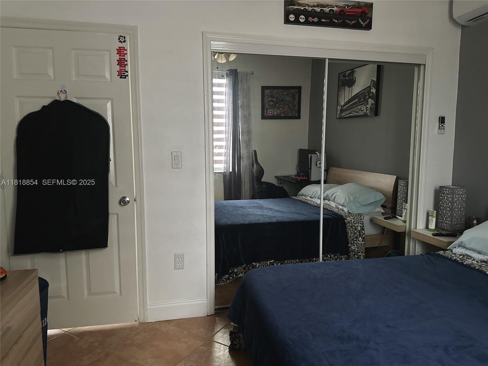 16419 Southwest 84th Street Miami, FL 33193 - Photo 6 of 15 a bedroom with a bed and a tv