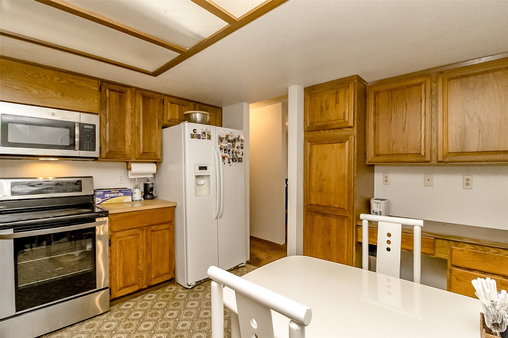22121 4th Avenue Southeast Bothell, WA 98021 - Photo 6 of 22 a kitchen with stainless steel appliances a stove a refrigerator and cabinets
