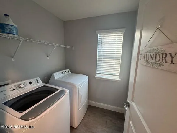 a utility room with dryer and washer