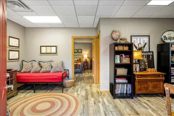 a bedroom with furniture and a book shelf