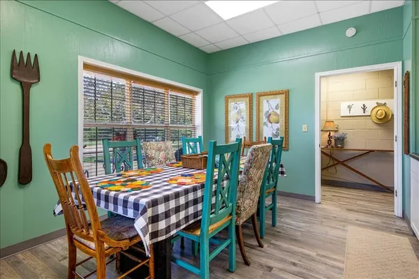a dining room with furniture and window