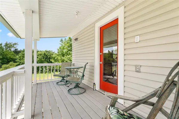 a balcony view with a seating space