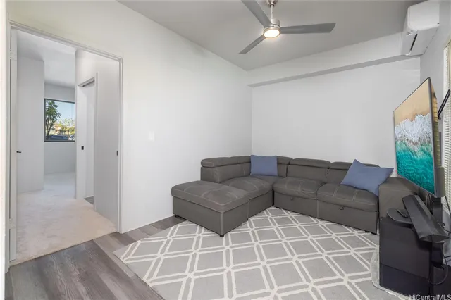 a living room with furniture and a rug