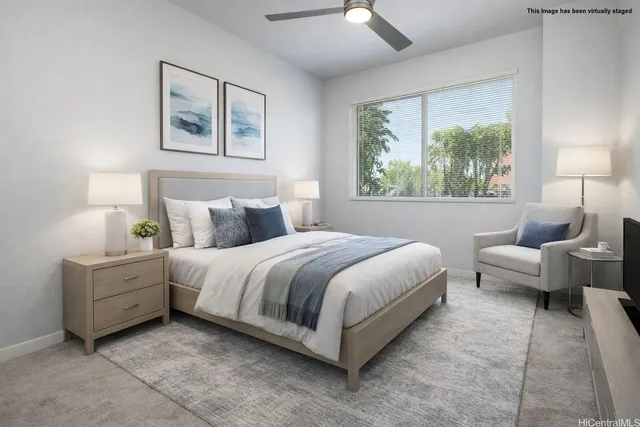 a bedroom with bed and a large window