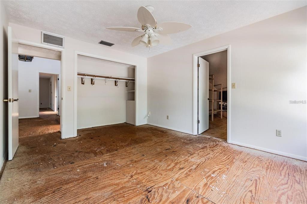 2620 Trent Road Palm Harbor, FL 34684 - Photo 13 of 21 a view of a livingroom with a dresser and chandelier fan
