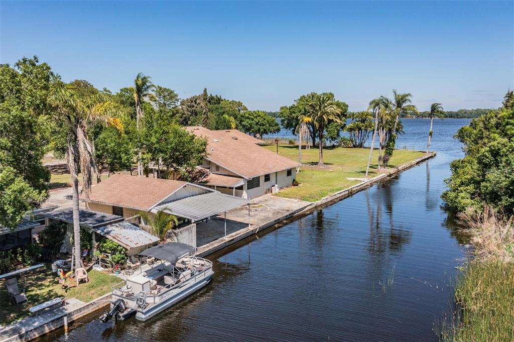 2620 Trent Road Palm Harbor, FL 34684 - Photo 20 of 21 a view of a swimming pool with lounge chairs