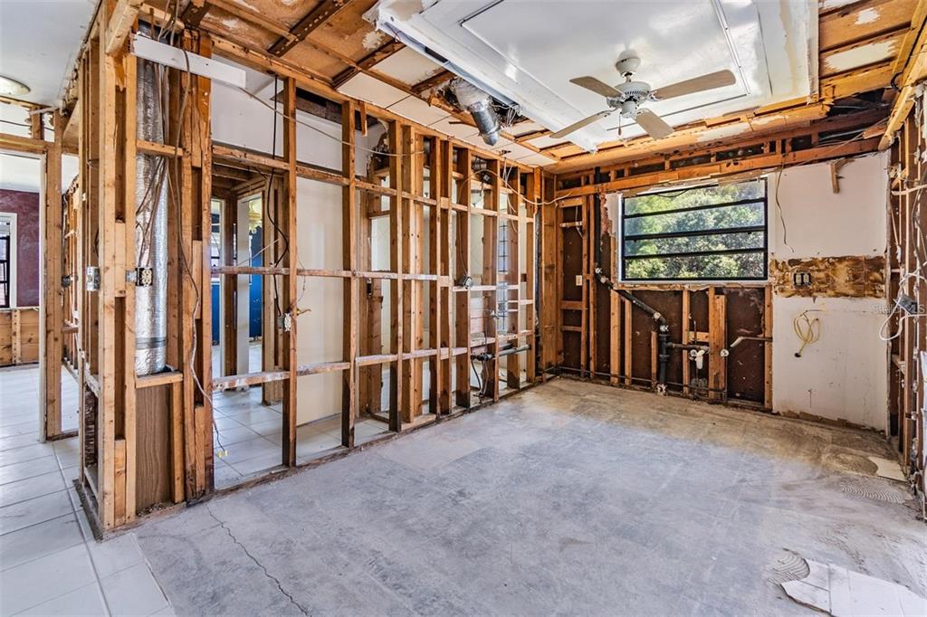 2620 Trent Road Palm Harbor, FL 34684 - Photo 4 of 21 a view of an empty room with wooden walls