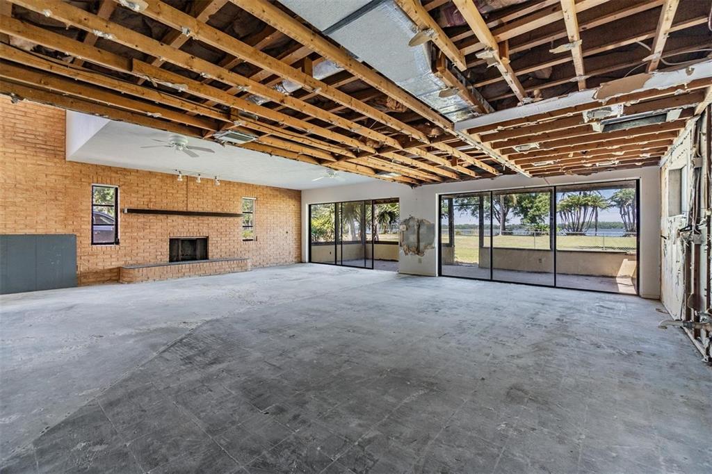 2620 Trent Road Palm Harbor, FL 34684 - Photo 6 of 21 a view of an empty room with a ceiling fan