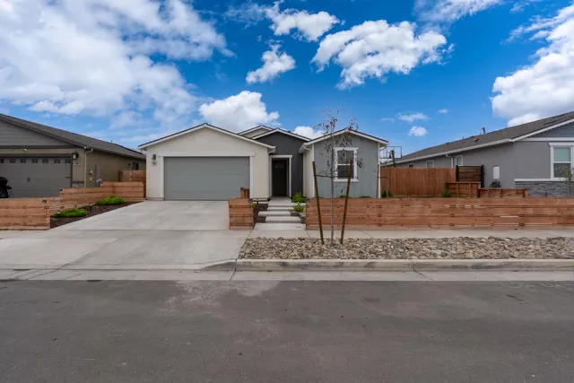 a view of a house with a snow yard and a yard