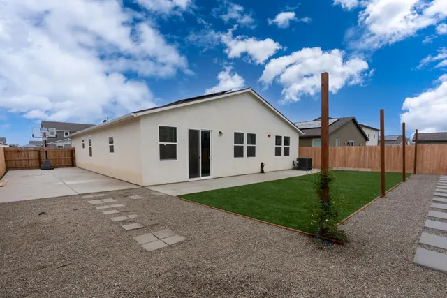 a view of a back yard of the house