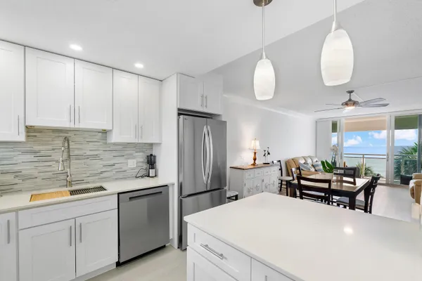 a kitchen with sink cabinets and wooden floor