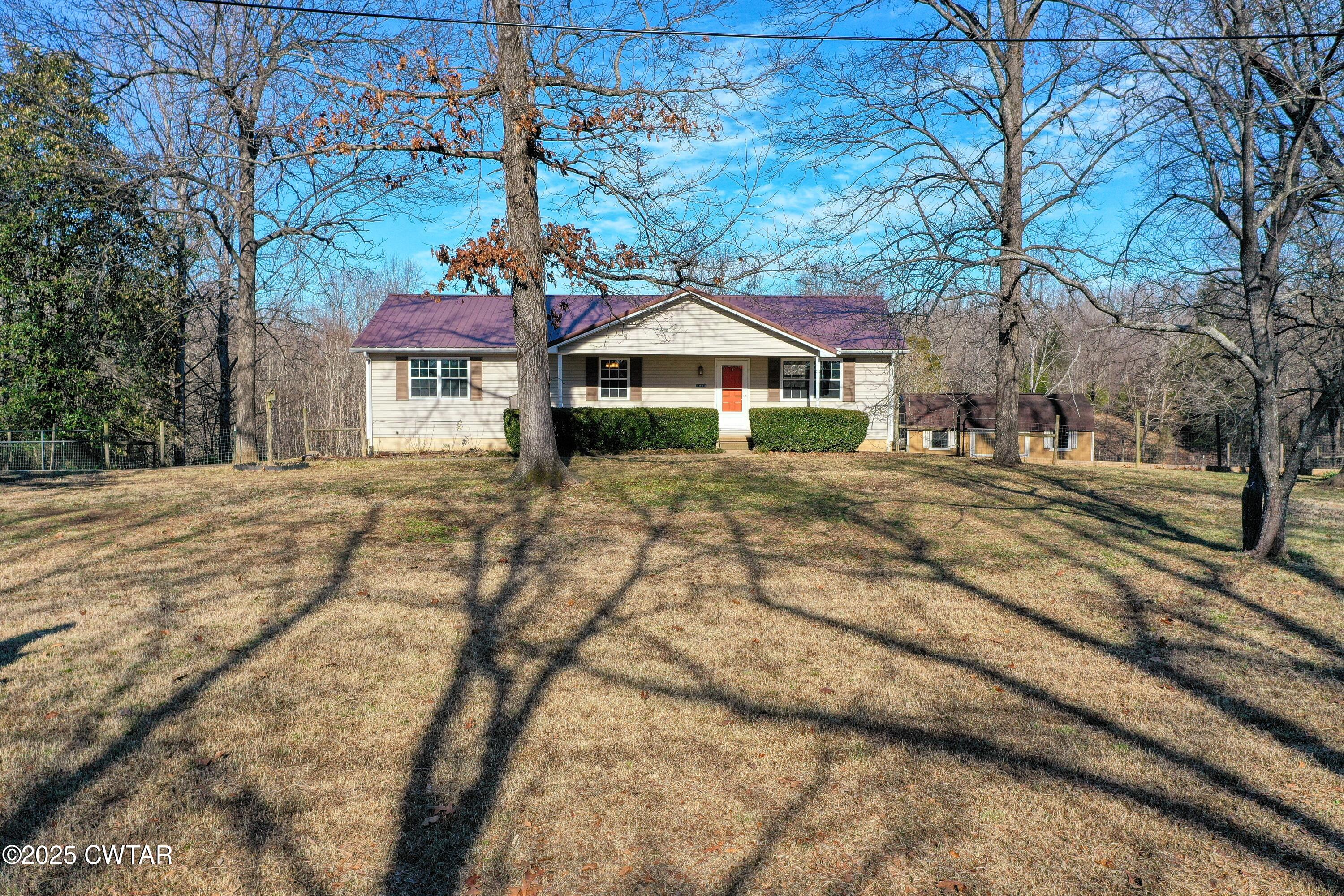 1555 Manleyville Road Springville, TN 38256 - Photo 4 of 29 a front view of a house with a yard