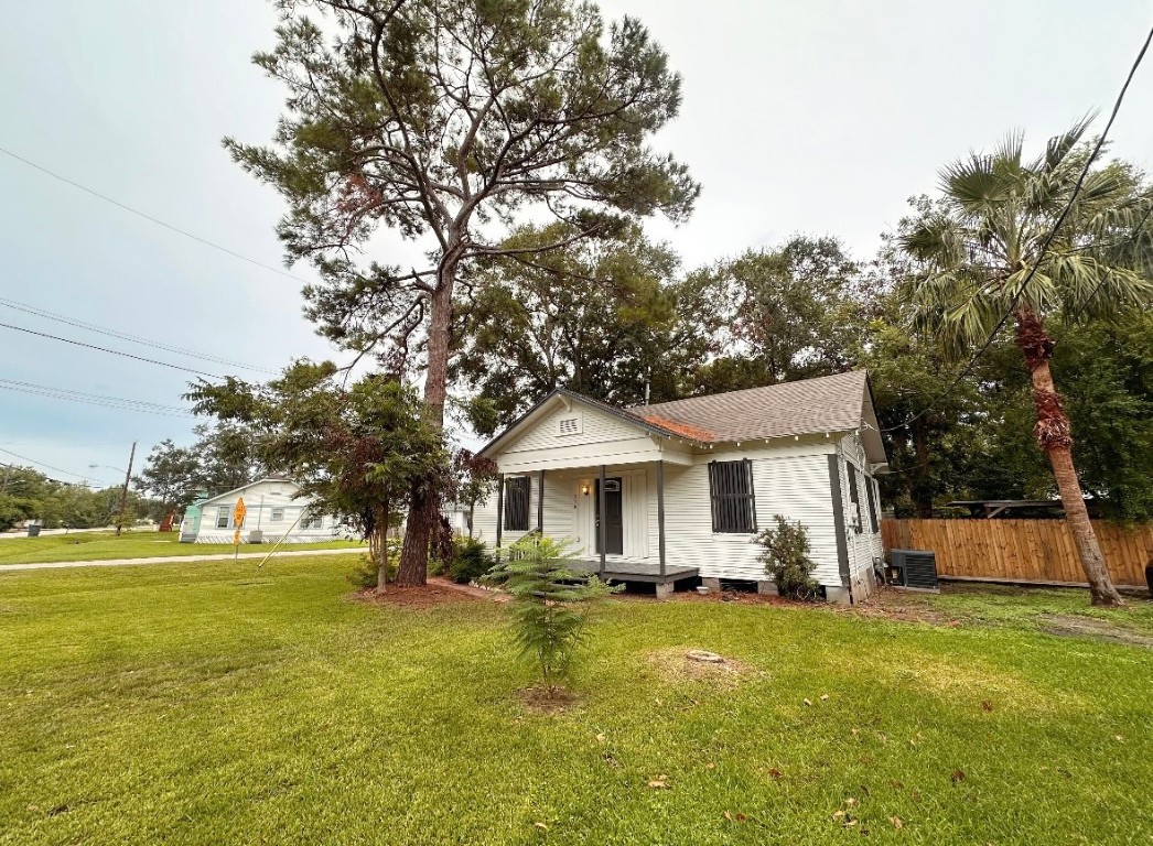 a front view of a house with a yard table and chairs