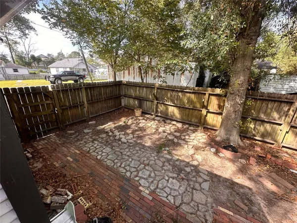 a view of outdoor space with wooden fence