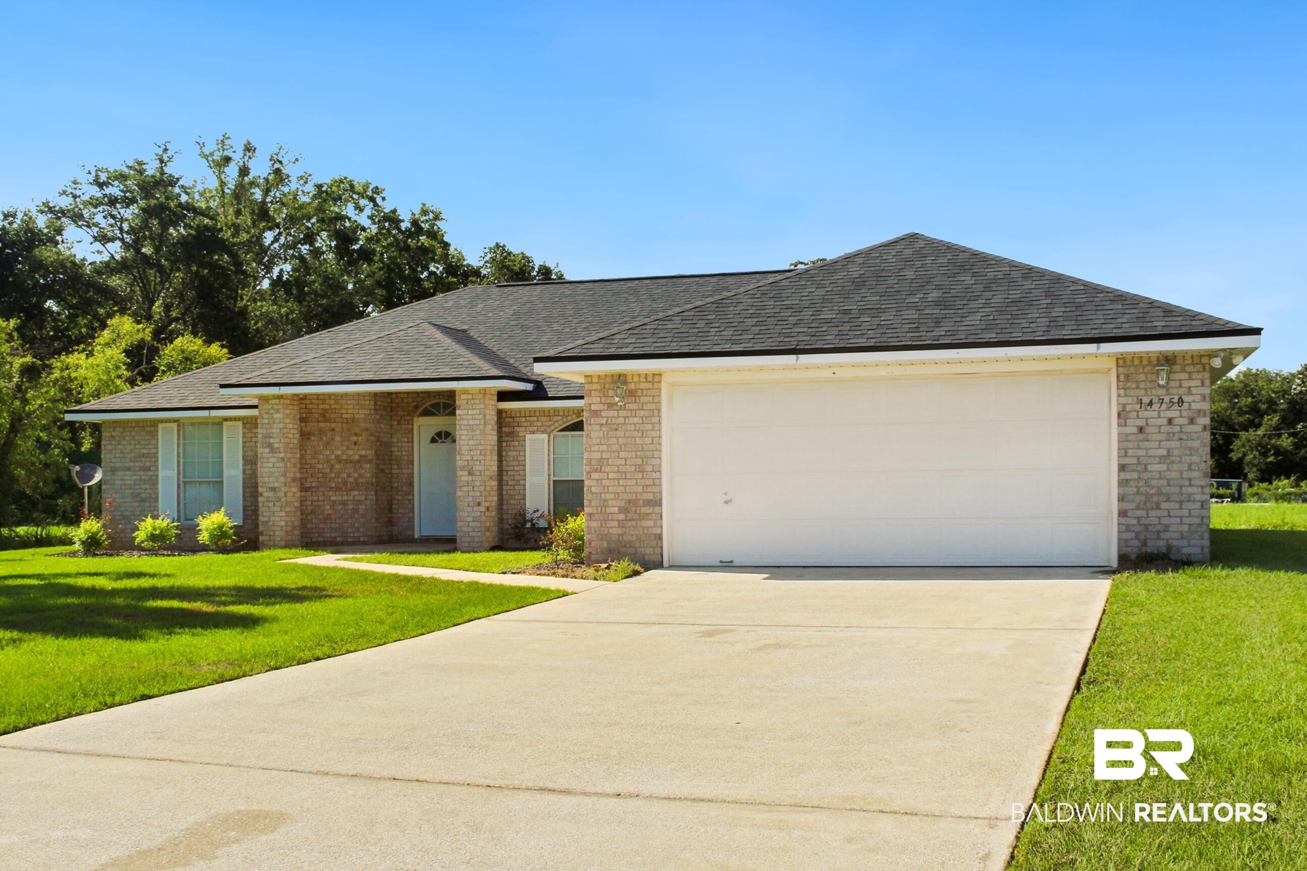 14750 Pawnee Court Foley, AL 36535 - Photo 2 of 34 Single story home featuring brick siding, driveway, a garage, and roof with shingles